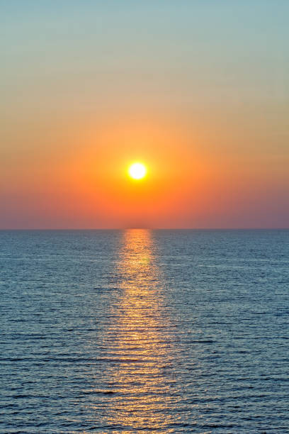istock Scenic sunset and sun path in the blue sea 1164091294