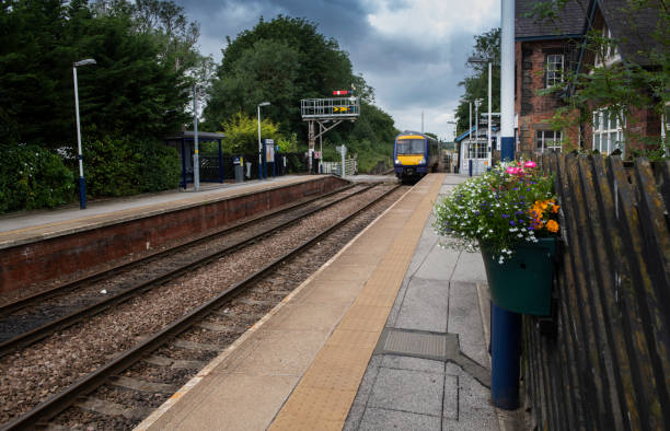 istock train arriving at a small station in Northern England 1164091522