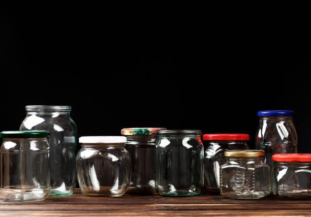 istock set of empty glass jars for conservation, on black  background 1164091541