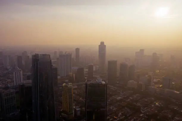 JAKARTA - Indonesia. June 25, 2019: Jakarta cityscape covering by air pollution at dawn time