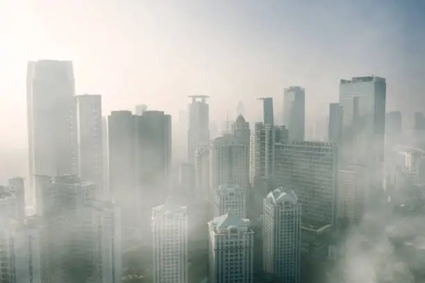 JAKARTA - Indonesia. April 24, 2019: Aerial view of severe air pollution with skyscrapers in Jakarta city