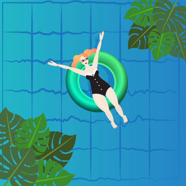 istock Young woman sunbath on ring in the swimming poo 1164095192