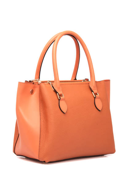 istock Orange Leather Women Bag On White Background 1164095234