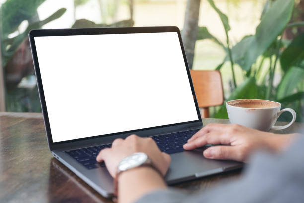 istock a woman using and typing on laptop with blank white desktop screen 1164095547