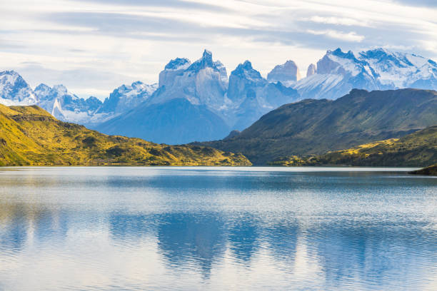istock Beautiful panoramic view of lake with Cuernos, horn mountains peak with lenticular cloud in autumn, Torres del Paine national park, south Patagonia, Chile 1164095945