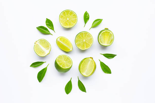 istock Limes with leaves isolated on white background. 1164096701