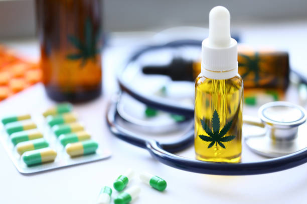 marijuana stethoscope oil pills are on table - medical marijuana imagens e fotografias de stock