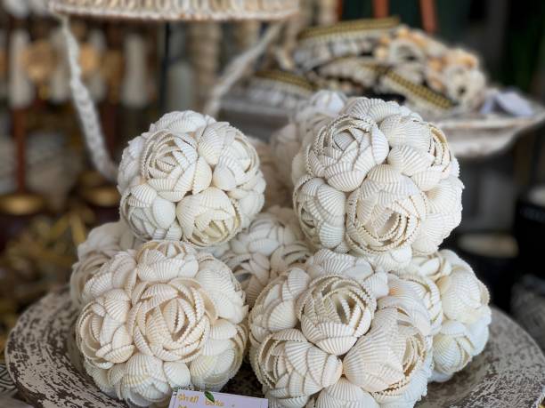 istock Decorative balls from white seashells in flower shape close up 1164099360