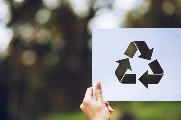 istock save world ecology concept environmental conservation with hands holding cut out paper recycle showing 1164100259