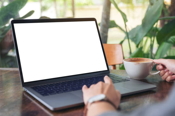 istock a woman using and touching laptop touchpad with blank white desktop screen 1164100470