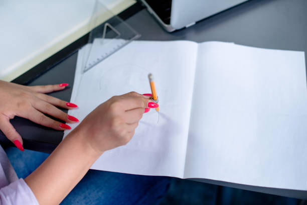 istock Young woman is doing a sketch for a project 1164100823