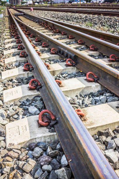 istock Two railway tracks merge together. 1164101567