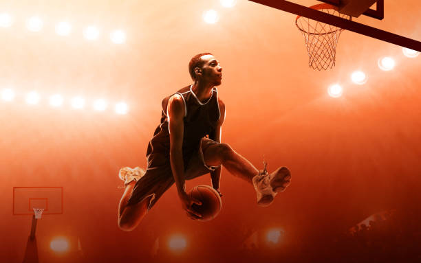 istock Basketball player making a basket. Jump shot. Slam Dunk 1164102849