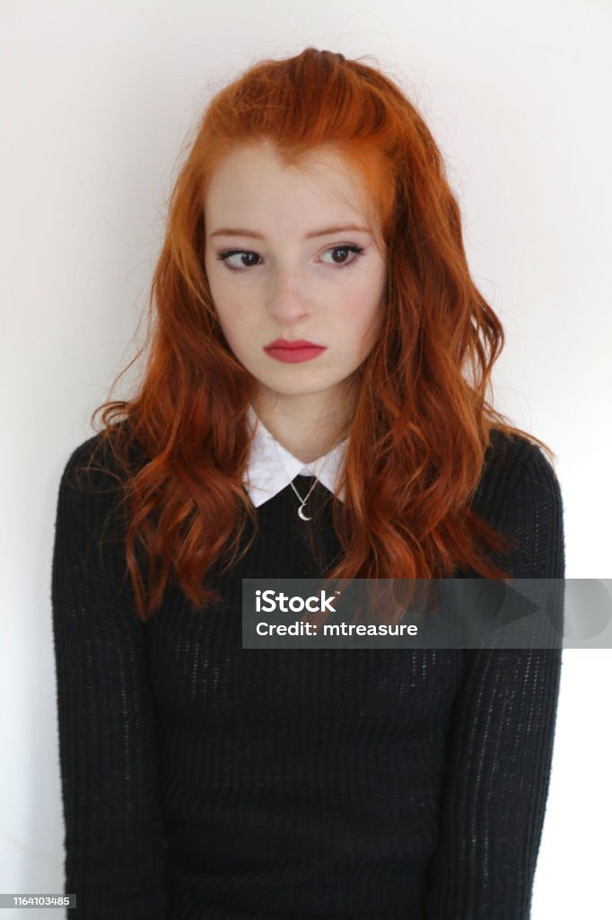 Image Of Pretty Young Teenage Redhead Girl 1315 Years Old With Long Untidy  Wavy Red Hair Ginger Hair Tied Back Looking Miserable Moody And Sad Wearing  Makeup And Red Lipstick Black Knitted