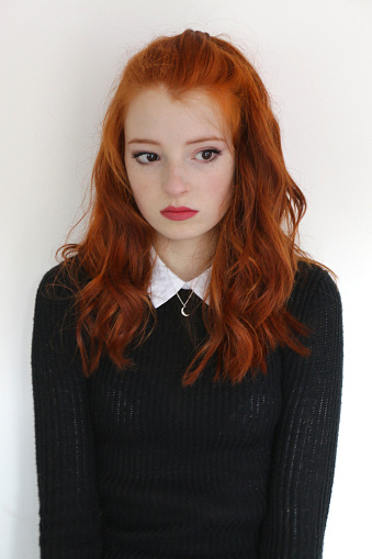 Image Of Pretty Young Teenage Redhead Girl 1315 Years Old With Long Untidy Wavy Red Hair Ginger Hair Tied Back Looking Miserable Moody And Sad Wearing Makeup And Red Lipstick Black Knitted Image Of Pretty Young Teenage Redhead Girl 1315 Years Old With Long Untidy Wavy Red Hair Ginger Hair Tied Back Looking Miserable Moody And Sad Wearing Makeup And Red Lipstick Black Knitted