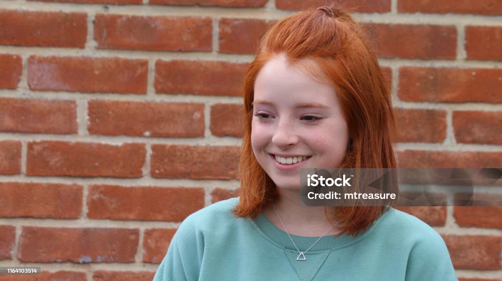Image Of Young Redhead Girl 13 14 Years Old With Short Bob Hairstyle And  Red Ginger Hair Tied Back Smiling Perfect Teeth After Dentist Wearing Brace  With Green Sweatshirt Silver Triangle Pendant