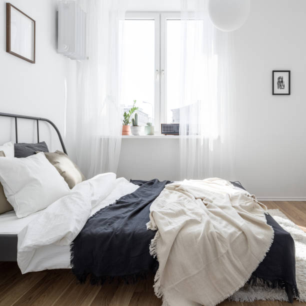 istock Minimalist bedroom in white 1164104479