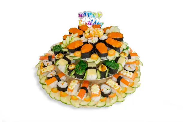 Closeup of sushi Japanese food with Happy Birthday text. Isolated on white background