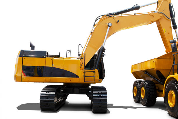 istock Yellow excavator loading soil into a truck 1164104819