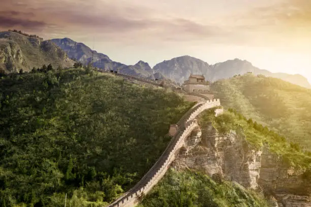 Wonderful view of Great Wall of China with ancient watchtower at sunrise time in Beijing