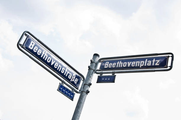 istock Street name sign with sky background: BeethovenStrasse (Beethoven Street) and Beethovenplatz 1164105666