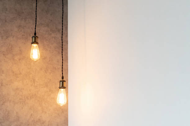 istock Wall with bulb light lamps in modern interior, copy space 1164105734