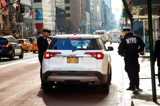 Police Stop Car New York City, United States - February 8, 2019: Police stop car for a control in east midtown of Manhattan stop gesture photos stock pictures, royalty-free photos & images