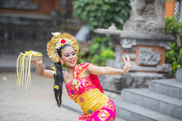 istock Beautiful dancer performing Pendet dance temple 1164108473