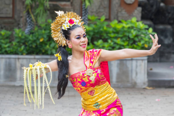 istock Female Pendet dancer showing a dance at outdoor 1164108477
