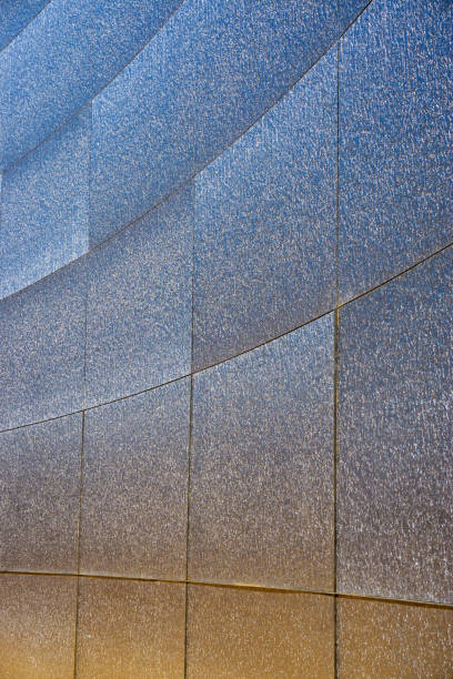 istock Architecture abstract detail background, shinning blue orange wall 1164108558