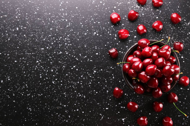 istock Sweet red cherry on textured background. 1164110487
