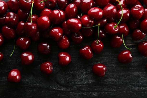 istock Sweet red cherry on textured background. 1164111200