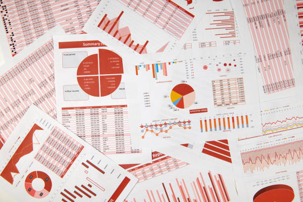 istock Flat top view of business workspace - reports with data, tables and analytic chart. Business financial accounting concept. 1164111896