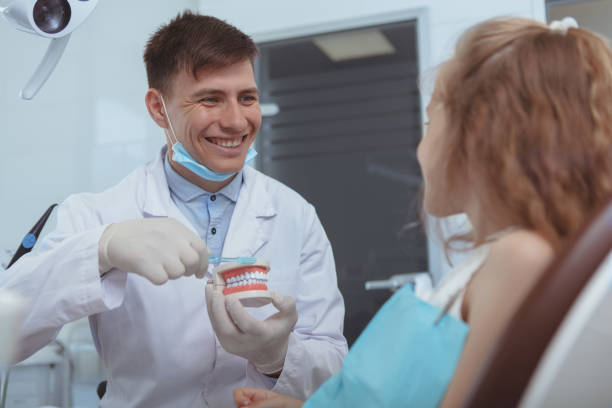 istock Young male dentist working at his clinic 1164111919