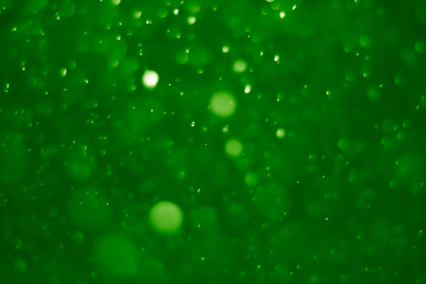istock Green ufo bokeh background abstract - pictures 1164112872