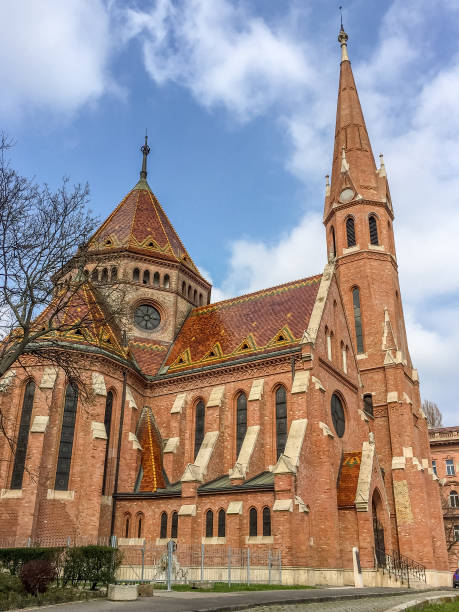 istock Church inside city with nice blue sky and clouds 1164113076