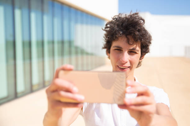 istock Content woman using smartphone outdoor 1164113950