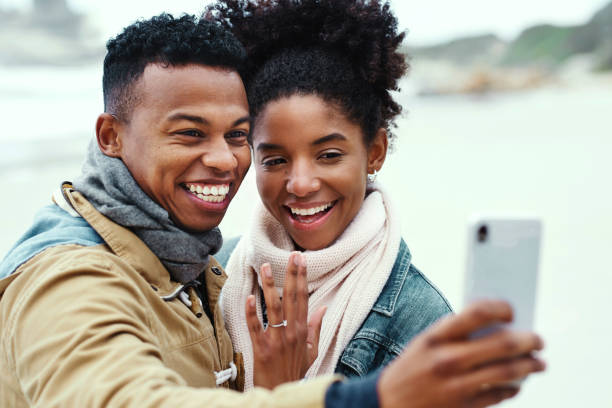 istock Let's announce our engagement online 1164123687