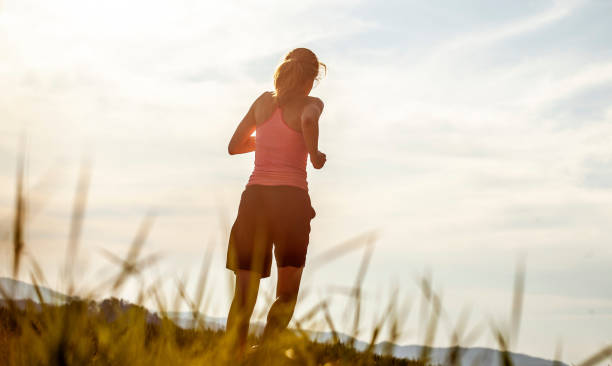 istock Athlete Running Across the Field 1164127894