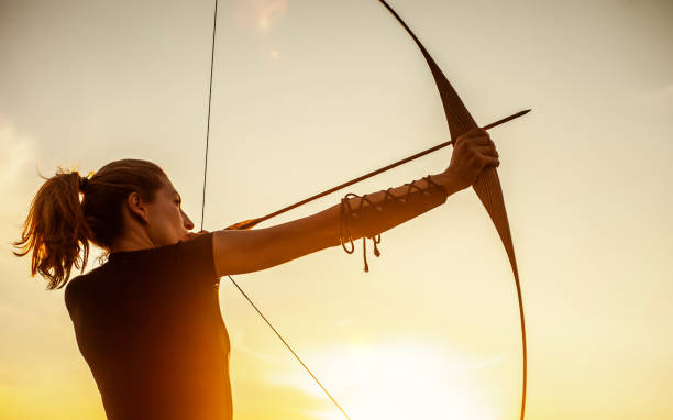 istock Woman Aiming In Archery 1164127997