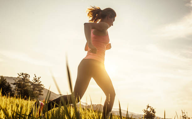 istock Athlete Running Across the Field 1164128169