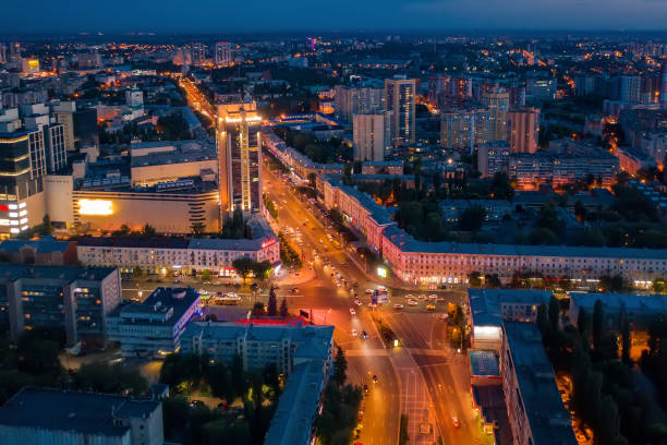 istock Night City Voronezh downtown or center panorama from above with illuminated road intersection, car traffic, modern business and residential buildings, aerial view 1164130875