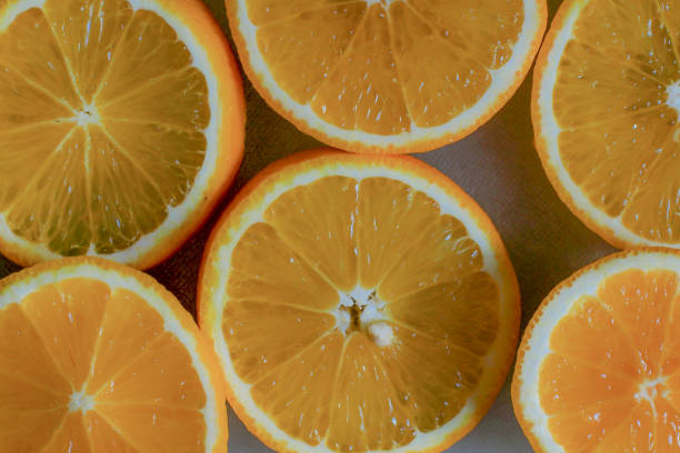 istock Orange slice. Background of half cut oranges 1164132255