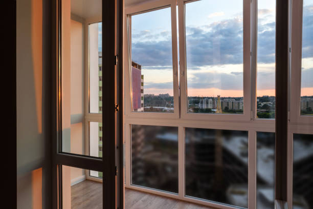 istock Clear high window with view on city and sunligth, copy space. Balcony interior 1164132391