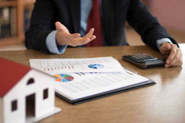 calculating housing sales stock photo