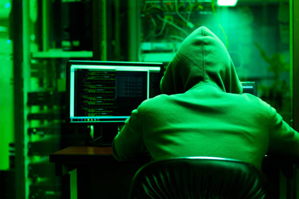 istock Stealing data from databases in the server rooms of various companies. Hackers can do anywhere with the network. The hacker concept in the room is dark green. 1164134984