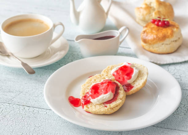 istock Classic scones with cream and berry jam 1164135491