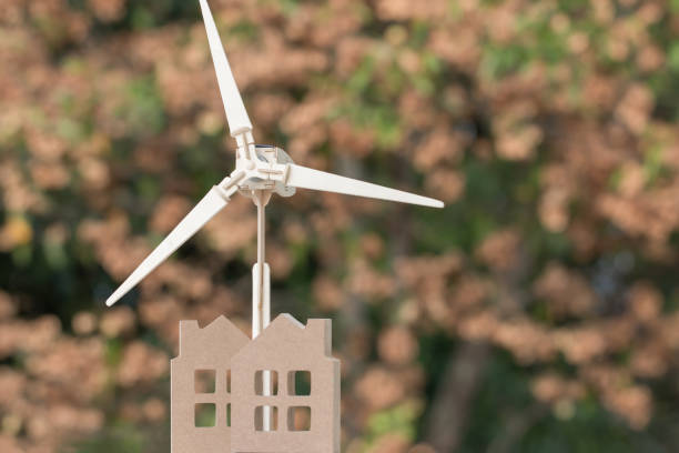 istock Power renewable energy future alternative with green environment and sustainable development concept, Home / wind turbine with blur background. Ideas for nature or eco environmental in modern 1164140253