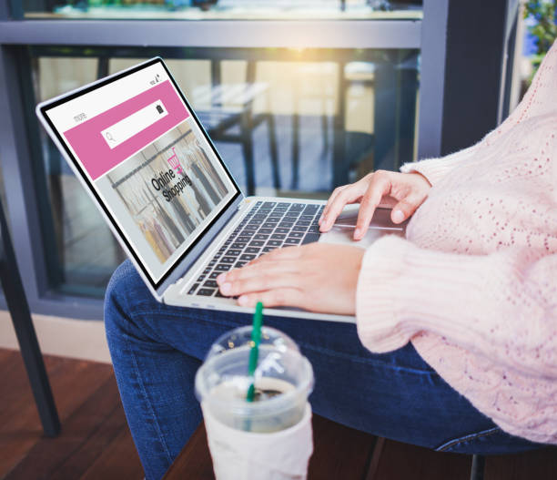 istock Young woman shopping online 1164140563
