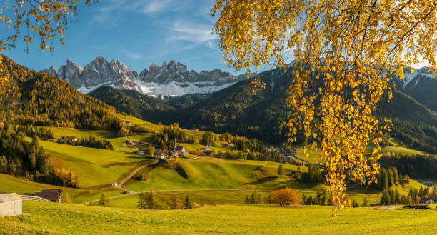 Landscape with autumn view on Dolomites Landscape with autumn view on Dolomites in world famous alpine village Santa Maddalena Val di Funes autumn field tree mountain stock pictures, royalty-free photos & images
